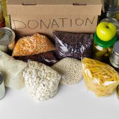 Donation box with various food. Pandemic support. Close up.
